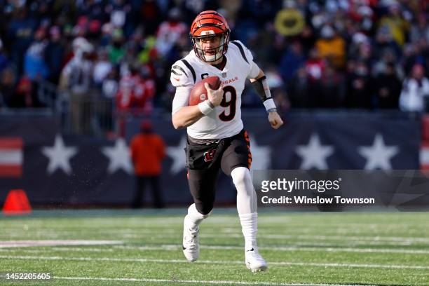 Joe Burrow of the Cincinnati Bengals runs the ball during the first quarter against the New England Patriots at Gillette Stadium on December 24, 2022...