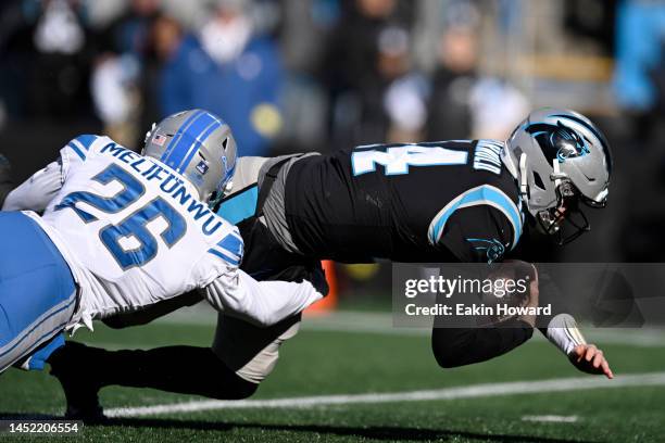 Ifeatu Melifonwu of the Detroit Lions tackles Sam Darnold of the Carolina Panthers during the second quarter of the game at Bank of America Stadium...