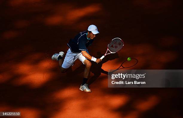 Go Soeda of Japan plays a backhand during his match against Andy Roddick of USA during day five of Power Horse World Team Cup at Rochusclub on May...