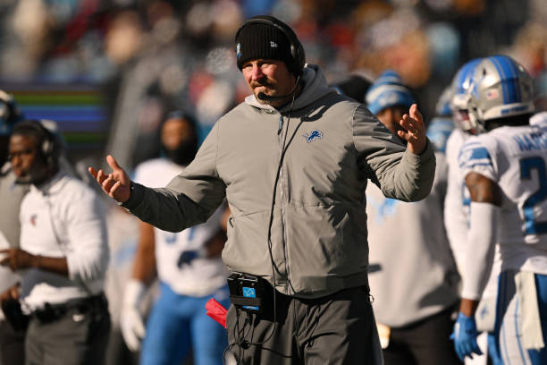 Head coach Dan Campbell of the Detroit Lions reacts during the first half of the game against the Carolina Panthers at Bank of America Stadium on...