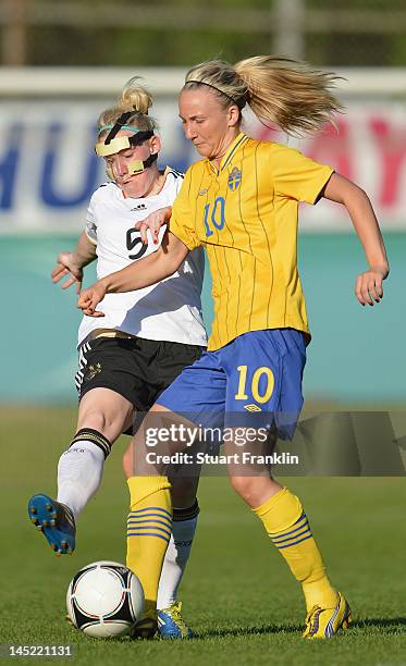 Marith Priessen of Germany is challenged by Emma Lund of Sweden during the U23's womens international friendly mtach between Germany and Sweden on...