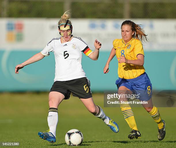 Marith Priessen of Germany is challenged by Emma Lund of Sweden during the U23's womens international friendly mtach between Germany and Sweden on...