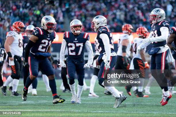 Adrian Phillips of the New England Patriots celebrates with Devin McCourty of the New England Patriots after McCourty's interception during the...