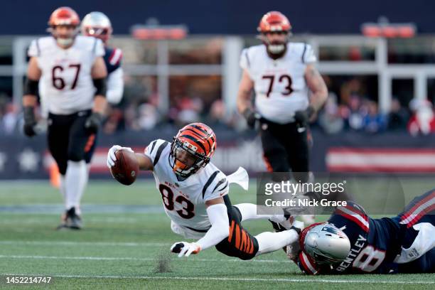 Tyler Boyd of the Cincinnati Bengals dives after being tackles by Ja'Whaun Bentley of the New England Patriots during the second quarter at Gillette...