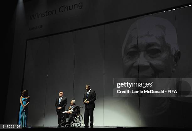 Winston Chung receives the Order of Merit Award from FIFA President Joseph S. Blatter and CONCACAF President Jeffrey Webb during the 62nd FIFA...