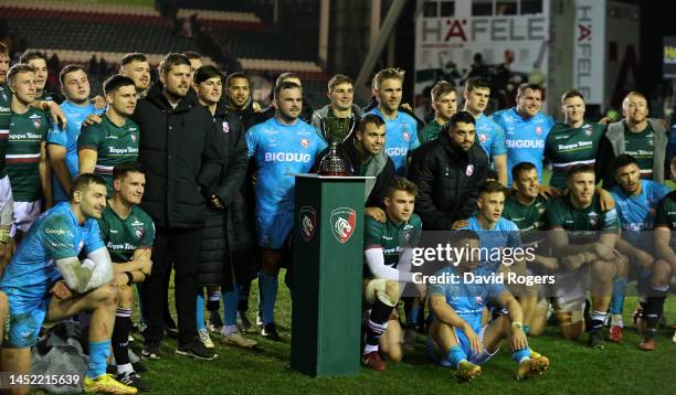 Former Leicester Tigers and Gloucester captain, Ed Slater poses with the players from both teams after presenting the inaugural Slater Cup to winning...