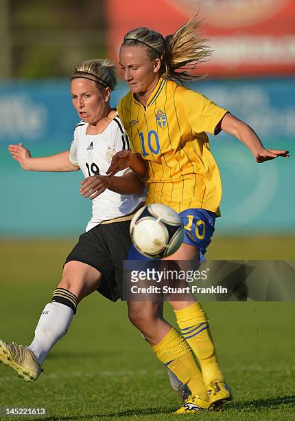 Svenja Huth of Germany is challenged by Emma Lund of Sweden during the U23's womens international friendly mtach between Germany and Sweden on May...