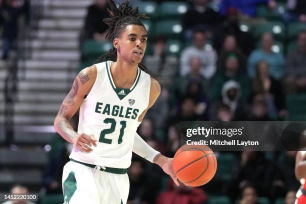 Emoni Bates of the Eastern Michigan Eagles dribbles the ball during a college basketball game against the Detroit Mercy Titans at the George Gervin...