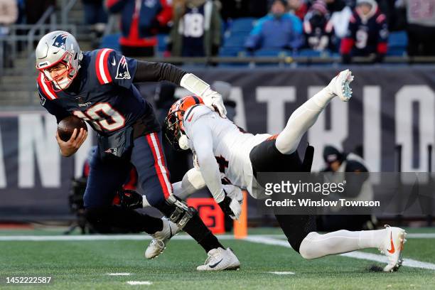 Vonn Bell of the Cincinnati Bengals attempts to tackle Mac Jones of the New England Patriots during the second quarter at Gillette Stadium on...