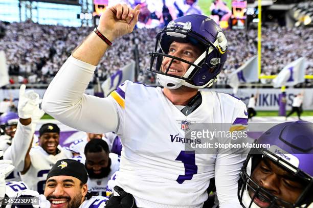 Greg Joseph of the Minnesota Vikings celebrates with teammates after kicking a game winning 61 yard field goal as time expired to beat the New York...