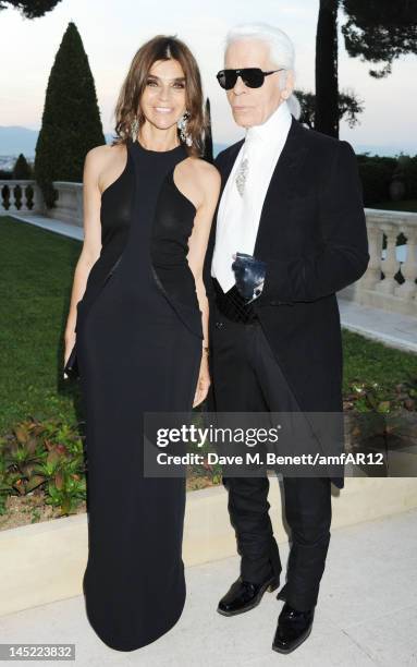 Editor in Chief of CR Fashion-Book Carine Roitfeld and fashion designer Karl Lagerfeld attend the 2012 amfAR's Cinema Against AIDS during the 65th...