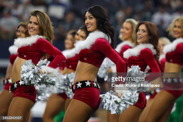 The Dallas Cowboys cheerleaders performs during the game against the Philadelphia Eagles at AT&T Stadium on December 24, 2022 in Arlington, Texas.