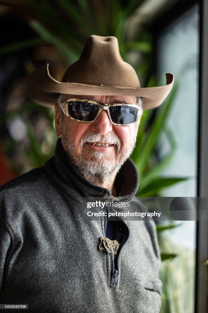 Fashionable senior man modern cowboy portrait
