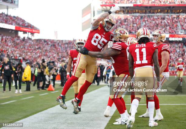 George Kittle of the San Francisco 49ers celebrates a touchdown during the third quarter in the game against the Washington Commanders at Levi's...