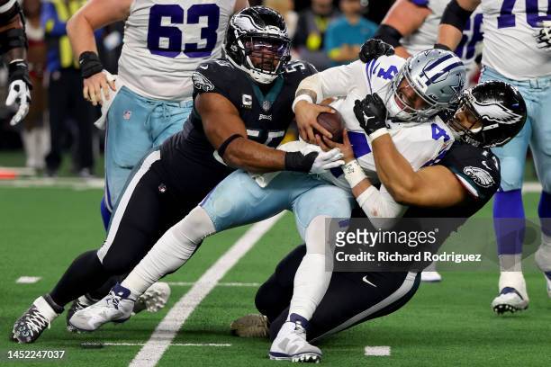 Dak Prescott of the Dallas Cowboys is tackled by Ndamukong Suh of the Philadelphia Eagles during the second half at AT&T Stadium on December 24, 2022...