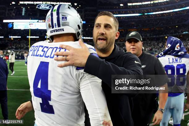 Head coach Nick Sirianni of the Philadelphia Eagles and Dak Prescott of the Dallas Cowboys embrace after the game at AT&T Stadium on December 24,...