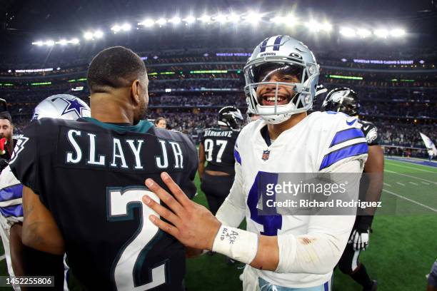 Darius Slay of the Philadelphia Eagles and Dak Prescott of the Dallas Cowboys embrace after the game at AT&T Stadium on December 24, 2022 in...