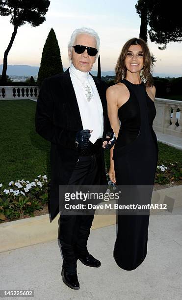 Fashion designer Karl Lagerfeld and Editor in Chief of CR Fashion-Book Carine Roitfeld attend the 2012 amfAR's Cinema Against AIDS during the 65th...
