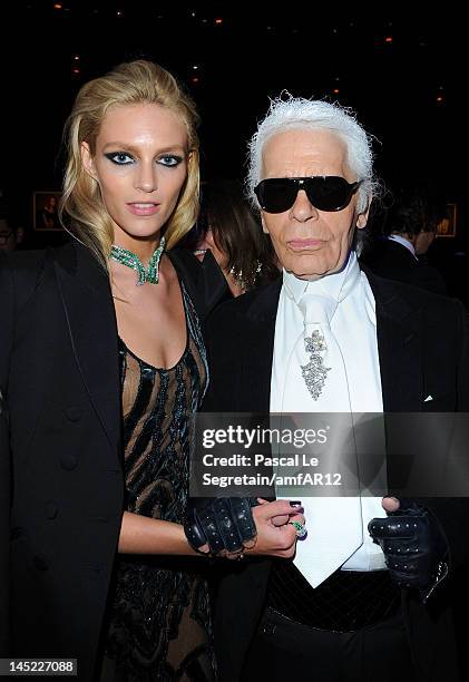 Karl Lagerfeld and Anja Rubik attend the 2012 amfAR's Cinema Against AIDS during the 65th Annual Cannes Film Festival at Hotel Du Cap on May 24, 2012...