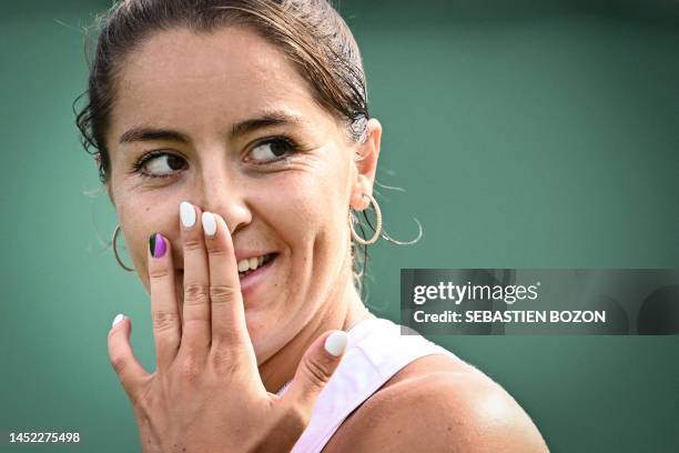 Britain's Jodie Burrage reacts as she plays against US player Caty McNally during their women's singles tennis match on the first day of the 2023...