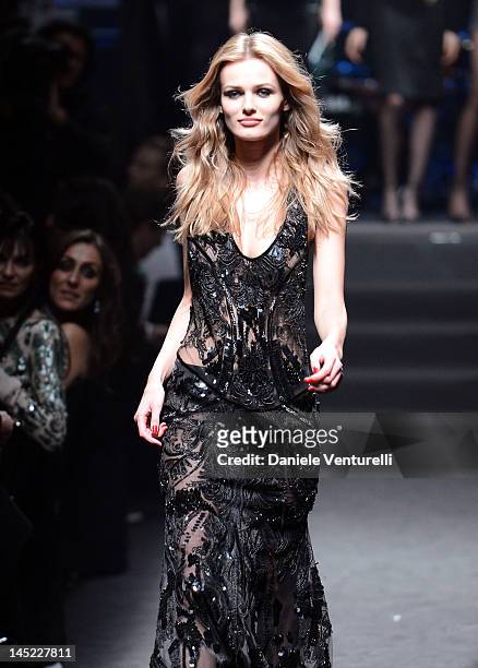Model Edita Vilkeviciute walks the runway the 2012 amfAR's Cinema Against AIDS during the 65th Annual Cannes Film Festival at Hotel Du Cap on May 24,...