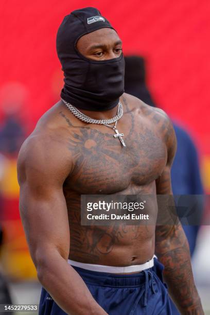 Metcalf of the Seattle Seahawks talks with a teammate during pregame warmups prior to the game against the Kansas City Chiefs at Arrowhead Stadium on...
