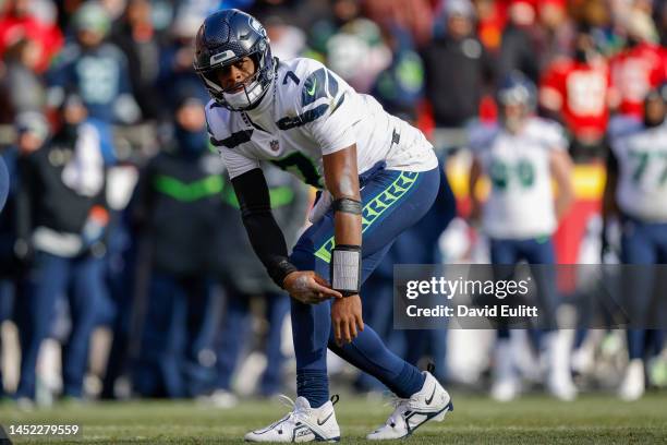 Geno Smith of the Seattle Seahawks motions towards a receiver during the second quarter against the Kansas City Chiefs at Arrowhead Stadium on...