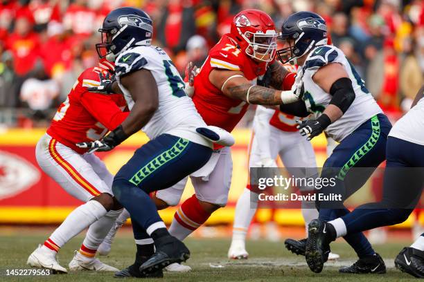 Danny Shelton of the Kansas City Chiefs rushes past Austin Blythe of the Seattle Seahawks during the third quarter at Arrowhead Stadium on December...