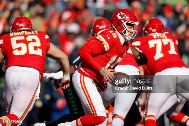 Patrick Mahomes of the Kansas City Chiefs looks to hand the football off during the first quarter against the Seattle Seahawks at Arrowhead Stadium...