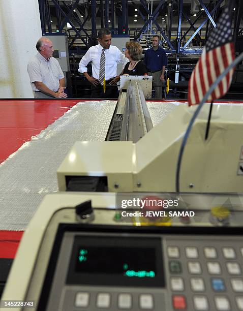 President Barack Obama speaks to employees as he tours TPI Composites, a wind blade manufacturer, in Newton, Iowa, on May 24, 2012. AFP PHOTO / Jewel...