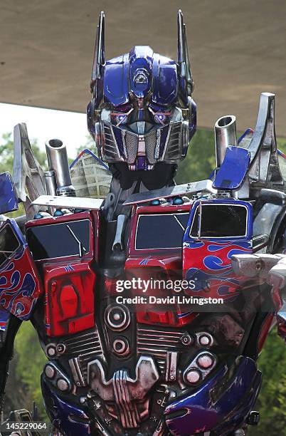 Transformer Optimus Prime figure appears at the world premiere of Universal Studios Hollywood's "Transformers: The Ride-3D" at Universal Studios...