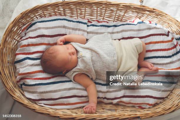 natural and safe materials and devices for baby. newborn in muslin clothing and reusable diaper. - babies only in cloth diapers stock-fotos und bilder