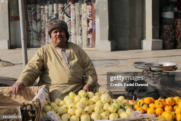 Man selling fruits .An Egyptian face ،Tour the streets of old Cairo daily life on December 24, 2022 in Cairo, Egypt.