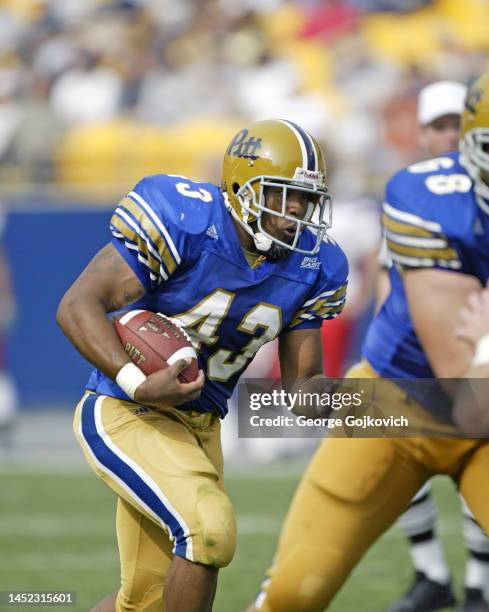 Running back Raymond Kirkley of the University of Pittsburgh Panthers runs with the football against the Youngstown State Penguins during a college...