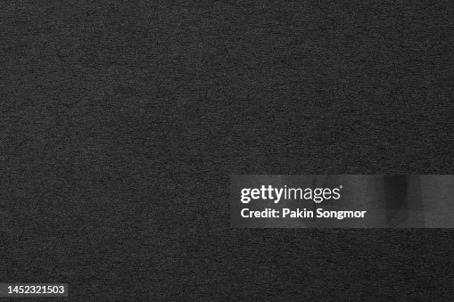 Black paper sheet texture cardboard background. Black paper sheet texture cardboard background.