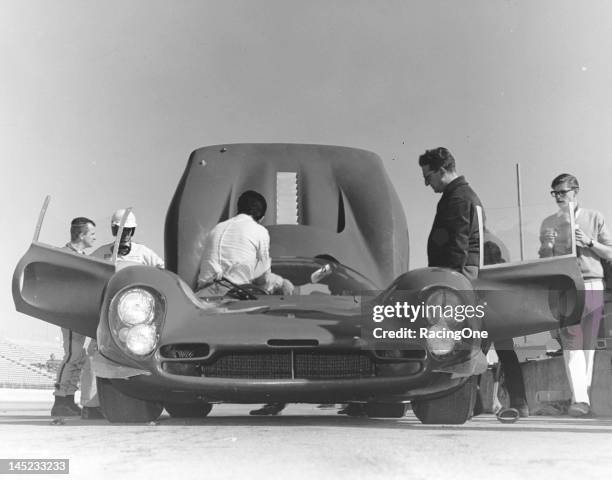 February 1967: Mechanics work on one of the Ferrari 330Ps that were entered in the 24 Hours of Daytona at Daytona International Speedway.