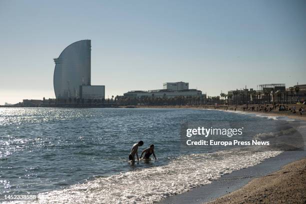 Couple swims at the Barceloneta beach, on 25 December, 2022 in Barcelona, Catalonia, Spain. The beach of Barcelona has dawned today, Christmas day...