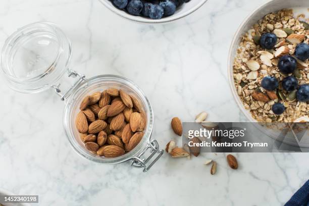 almonds at the breakfast table - milk plant stockfoto's en -beelden