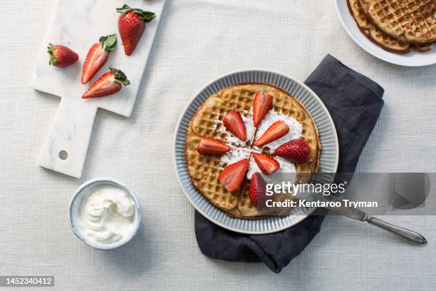 waffles with strawberries and cream - food stock pictures, royalty-free photos & images