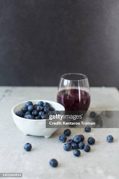 blueberries and blueberry juice - fruit bowl stock pictures, royalty-free photos & images