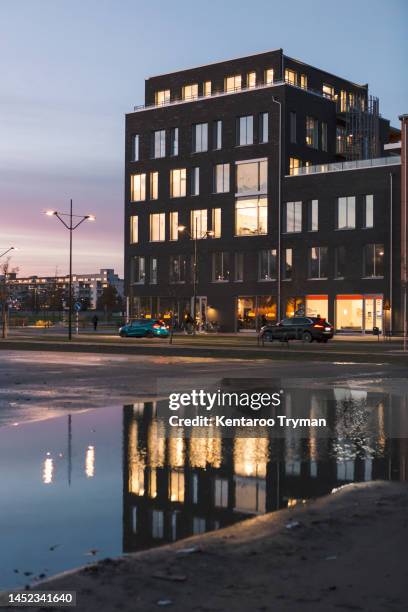 residential building at dusk - malmo stock pictures, royalty-free photos & images