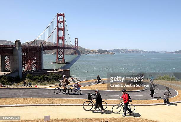 Tourists ride bicycles on a newly constructed bike path near the Golden Gate Bridge on May 24, 2012 in San Francisco, California. The Golden Gate...