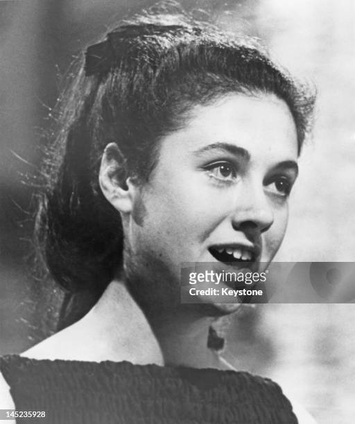 Year-old Italian singer Gigliola Cinquetti singing the winning song, song 'Non ho l'eta', at the Eurovision Song Contest, held at the Tivolis...