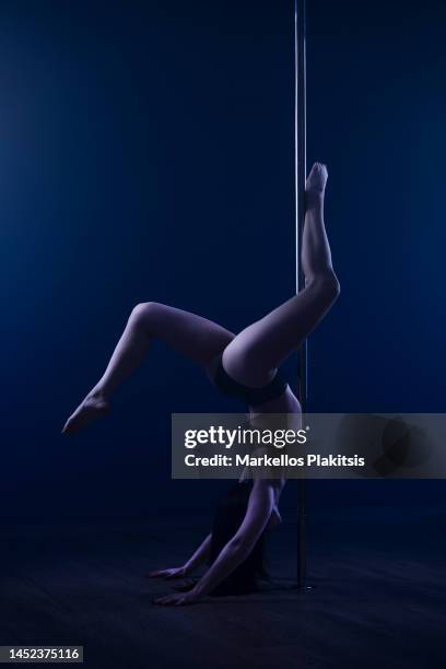 pole dancer - pole dance stock pictures, royalty-free photos & images