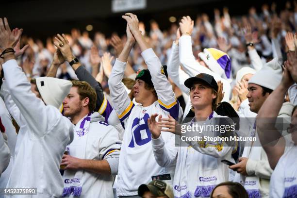 Fans cheer in the stands before the game between the Minnesota Vikings and New York Giants at U.S. Bank Stadium on December 24, 2022 in Minneapolis,...
