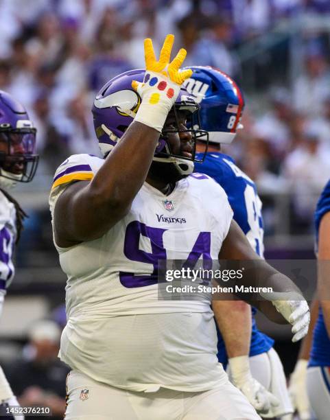 Dalvin Tomlinson of the Minnesota Vikings celebrates after a play in the first quarter of the game against the New York Giants at U.S. Bank Stadium...