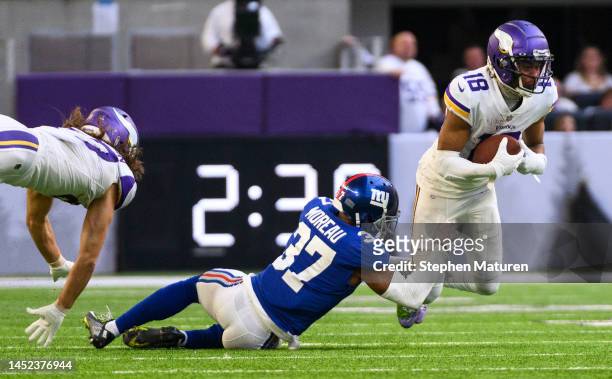 Justin Jefferson of the Minnesota Vikings is tackled by Fabian Moreau of the New York Giants in the third quarter of the game at U.S. Bank Stadium on...
