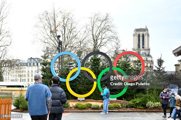 The logo for the Paris 2024 Summer Olympic and Paralympic Games in the Christmas village is shown in front of the Hotel de Ville on December 25, 2022...