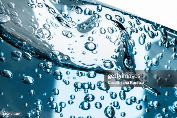 water, gel with bubbles. transparent blue moisture serum for face. hyaluronic acid. cosmetic products for makeup and skin care. beauty pattern. - texture maquillage photos et images de collection