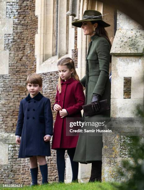 Prince Louis, Princess Charlotte and Catherine, Princess of Wales attend the Christmas Day service at Sandringham Church on December 25, 2022 in...